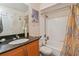 Bright bathroom featuring shower/tub combo and neutral shower curtain at 3261 Haviland Ct # 303, Palm Harbor, FL 34684