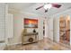 Bedroom with console table, sunset art, and ensuite bathroom access at 3261 Haviland Ct # 303, Palm Harbor, FL 34684