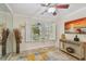 Bedroom with natural light coming from windows and a modern console table at 3261 Haviland Ct # 303, Palm Harbor, FL 34684