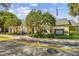 Exterior view of a bright and inviting clubhouse in a well-manicured neighborhood at 3261 Haviland Ct # 303, Palm Harbor, FL 34684
