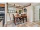 The dining room features a wooden table and chairs at 3261 Haviland Ct # 303, Palm Harbor, FL 34684