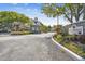 Stone entrance to a community with manicured landscaping at 3261 Haviland Ct # 303, Palm Harbor, FL 34684