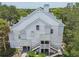 Two-story condo building featuring updated exterior with well-maintained staircases and landscaping at 3261 Haviland Ct # 303, Palm Harbor, FL 34684