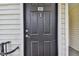 Close up of the black door and number 303 at 3261 Haviland Ct # 303, Palm Harbor, FL 34684