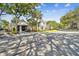 Community garage with a golf cart parked outside at 3261 Haviland Ct # 303, Palm Harbor, FL 34684
