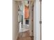 Hallway with tile flooring that leads to a living room with a fireplace at 3261 Haviland Ct # 303, Palm Harbor, FL 34684