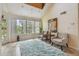 Bright living room with plush rug, accent chairs, and plenty of natural light at 3261 Haviland Ct # 303, Palm Harbor, FL 34684
