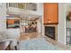 Open living space with high ceilings, fireplace, and adjacent kitchen and dining area at 3261 Haviland Ct # 303, Palm Harbor, FL 34684