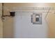View of the inside of a pantry with exposed breaker box and wire shelving and an outlet at 3261 Haviland Ct # 303, Palm Harbor, FL 34684