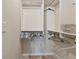 Walk-in closet features built-in shelves and rods for optimal organization at 3261 Haviland Ct # 303, Palm Harbor, FL 34684