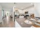 Bright, modern kitchen with stainless steel appliances and a view of the dining area at 32708 Winterwood Blvd, Wesley Chapel, FL 33543