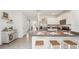 Well-lit kitchen with stainless steel appliances and a breakfast bar with seating at 32708 Winterwood Blvd, Wesley Chapel, FL 33543