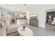 Open-concept living space flows into kitchen and dining, great for modern living and entertaining at 32708 Winterwood Blvd, Wesley Chapel, FL 33543
