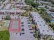 Aerial view of condo buildings, tennis court and parking at 3281 Beneva Rd # 202, Sarasota, FL 34232