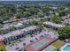Aerial view of a condo community featuring tennis court and a bocce ball court at 3281 Beneva Rd # 202, Sarasota, FL 34232