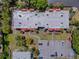 Overhead view of condo buildings, parking lot and landscaping at 3281 Beneva Rd # 202, Sarasota, FL 34232
