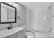 This fully updated bathroom features a bathtub with subway tile and a stylish vanity at 3281 Beneva Rd # 202, Sarasota, FL 34232