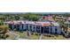 Exterior view of condo buildings featuring multiple balconies and well-maintained landscaping at 3281 Beneva Rd # 202, Sarasota, FL 34232