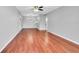 Open concept living and dining room features hardwood floors and natural light at 3281 Beneva Rd # 202, Sarasota, FL 34232