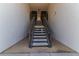Exterior stairway leading to upper-level units in a condominium complex at 3281 Beneva Rd # 202, Sarasota, FL 34232