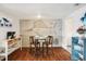 Charming dining area with unique wall art and hardwood floors for a cozy and inviting space at 5616 Riddle Rd, Holiday, FL 34690