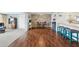 Stylish dining area with hardwood floors that blends into an open floor plan, offering flexibility at 5616 Riddle Rd, Holiday, FL 34690