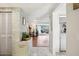 Hallway featuring tile flooring and leading to the living room with views of the waterfront at 5616 Riddle Rd, Holiday, FL 34690