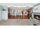 Bright and open living area with hardwood floors, a cozy fireplace, and an inviting atmosphere at 5616 Riddle Rd, Holiday, FL 34690