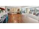 Spacious, sun-drenched living room showcases beautiful floors and scenic water views at 5616 Riddle Rd, Holiday, FL 34690