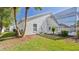 Backyard with a view of the screened-in pool and patio attached to the home at 7001 Cohasset Cir, Riverview, FL 33578