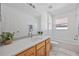Bathroom with quartz countertops, undermount sink, and tiled floors at 7001 Cohasset Cir, Riverview, FL 33578