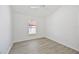 Bright bedroom with ceiling fan and large window provides ample light at 7001 Cohasset Cir, Riverview, FL 33578