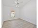 Bright bedroom with ceiling fan and large window provides ample light at 7001 Cohasset Cir, Riverview, FL 33578