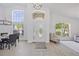 Inviting foyer with soaring ceilings and large windows, offering plenty of natural light at 7001 Cohasset Cir, Riverview, FL 33578