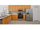 Well-appointed kitchen with ample counter space, stainless appliances, and modern cabinetry at 7001 Cohasset Cir, Riverview, FL 33578