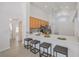 Open kitchen design with an eat-in bar, stainless steel appliances, and plenty of cabinet space at 7001 Cohasset Cir, Riverview, FL 33578