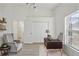 Office with a desk, shelves, ceiling fan and wood-look floors at 7001 Cohasset Cir, Riverview, FL 33578
