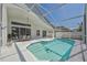 Enclosed pool with ample seating and a covered patio, perfect for outdoor entertaining at 7001 Cohasset Cir, Riverview, FL 33578