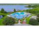 Enjoy this community pool, featuring a fountain and stunning views of the lake at 7001 Cohasset Cir, Riverview, FL 33578