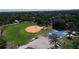 A park with a baseball field, basketball court, and parking lot can be seen from the aerial view at 701 W Idlewild Ave, Tampa, FL 33604