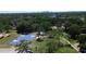 Aerial view of community park with a basketball court, trees, and walking paths for recreational activities at 701 W Idlewild Ave, Tampa, FL 33604