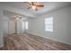 Spacious bedroom featuring wood floors, neutral tones and a ceiling fan at 701 W Idlewild Ave, Tampa, FL 33604
