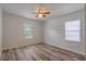 Empty bedroom with ceiling fan and window providing natural light at 701 W Idlewild Ave, Tampa, FL 33604