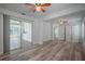 Open bedroom area with access to sunroom, walk-in closet, and ceiling fan at 701 W Idlewild Ave, Tampa, FL 33604