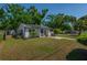 Well maintained home with a healthy lawn, solar panels, and manicured landscaping at 701 W Idlewild Ave, Tampa, FL 33604