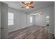 Spacious living room with wood flooring, neutral tones, and bright sunlight at 701 W Idlewild Ave, Tampa, FL 33604