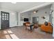 Bright, staged sunroom featuring tile flooring, ceiling fan, and comfortable seating at 701 W Idlewild Ave, Tampa, FL 33604