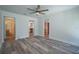 Open-concept layout with bright living space and wood floors leading to other rooms at 701 W Idlewild Ave, Tampa, FL 33604