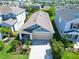 Charming single-Gathering home with a well-maintained lawn, lush landscaping, and attached two car garage at 7417 Sungold Meadow Ct, Apollo Beach, FL 33572