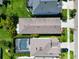 A bird's eye view of residences in a well-planned community surrounded by greenery and a nearby roadway at 7417 Sungold Meadow Ct, Apollo Beach, FL 33572